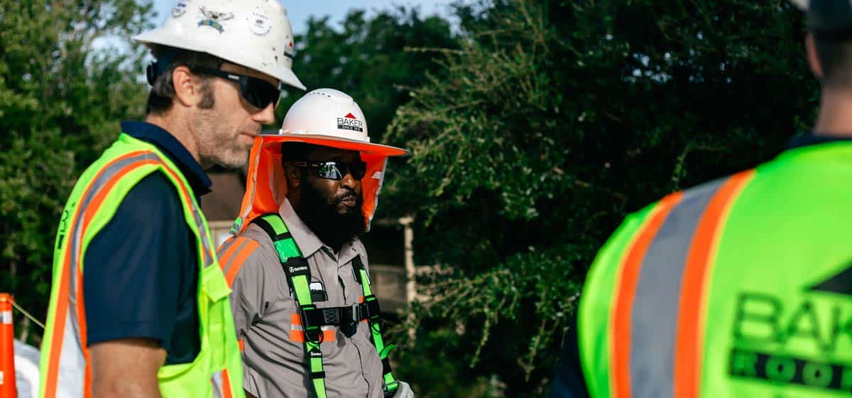 Two Baker crew members on site